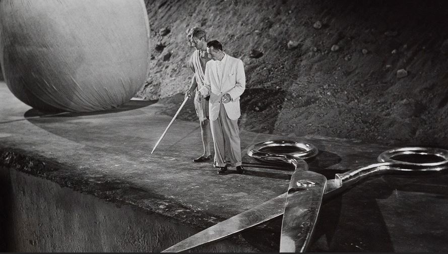 Director Jack Arnold goes over a scene with Grant Williams. The oversized props are especially well done. Incredible Shrinking Man on set scene showing huge props