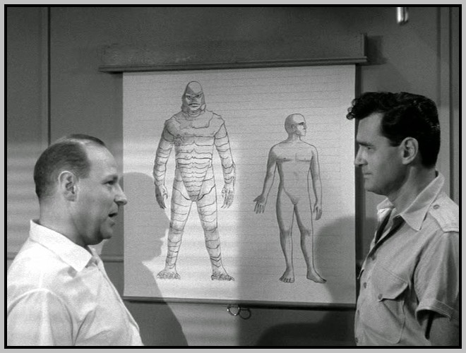 Maurice Manson and Jeff Morrow examine a drawing comparing the Gill-man to a normal human. Maurice Manson and Jeff Morrow examine a drawing comparing the Gill-man to a normal human.