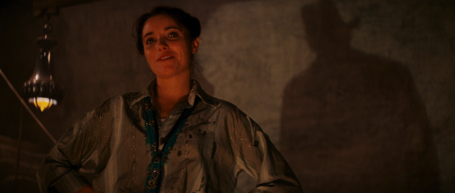 Raiders of the Lost Ark scene with Marion, with Indie's shadow in back of her on the wall. Raiders of the Lost Ark scene with Marion, with Indie's shadow in back of her on the wall.