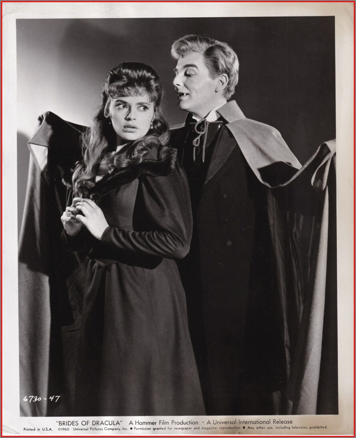 Lovely Yvonne Monlaur in the grasp of Baron Meinster, portrayed by David Peel. Brides of Dracula publicity still