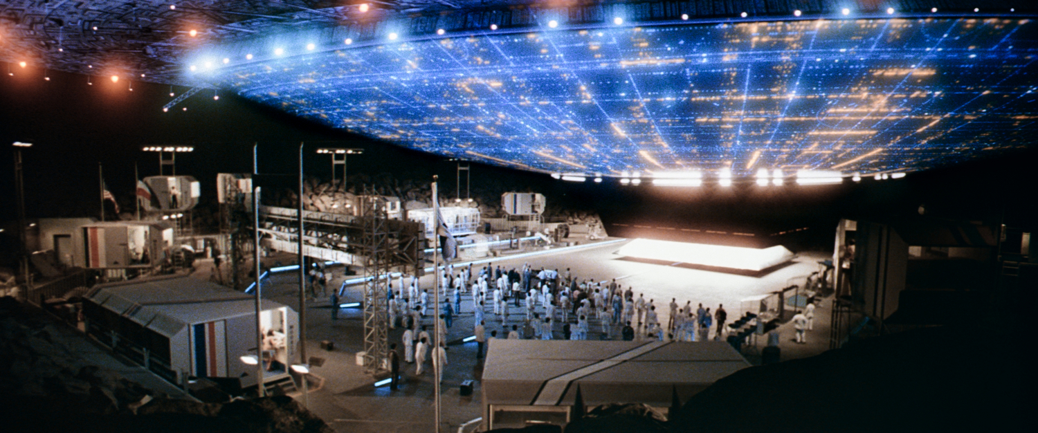 Close Encounters for the Third Kind movie scene showing mom reunited with son. Close Encounters for the Third Kind movie scene showing bottom of alien ship in mountain receiving area.